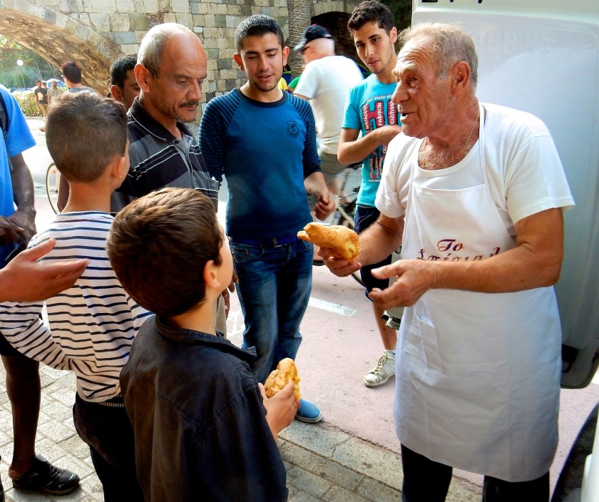 Greece-Headline-News-Dionysis-Arvanitakis-Feeds-Thousand-Refugees-With-Breads